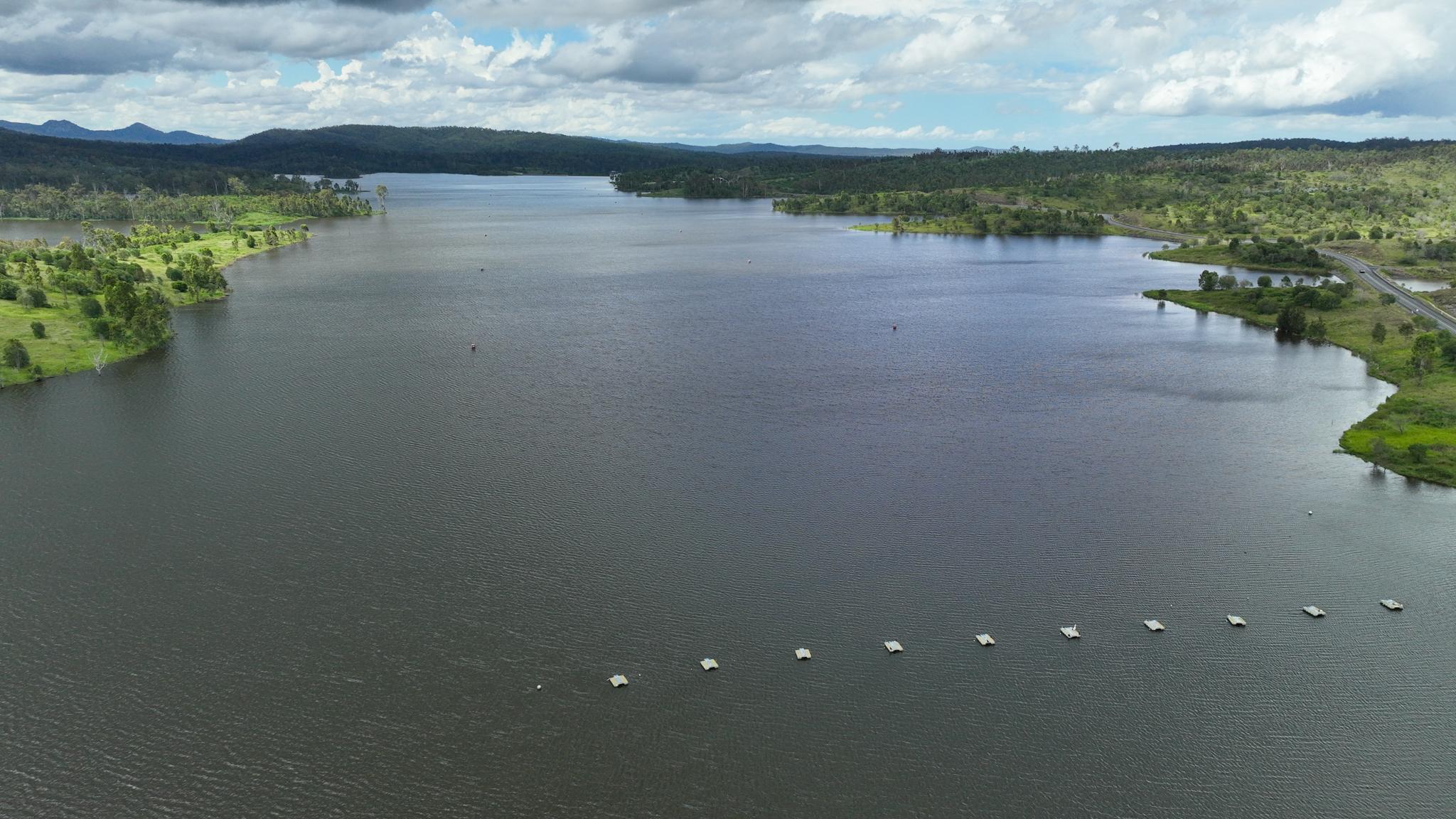 Aerial view of Wyaralong Dam with rowing start gate