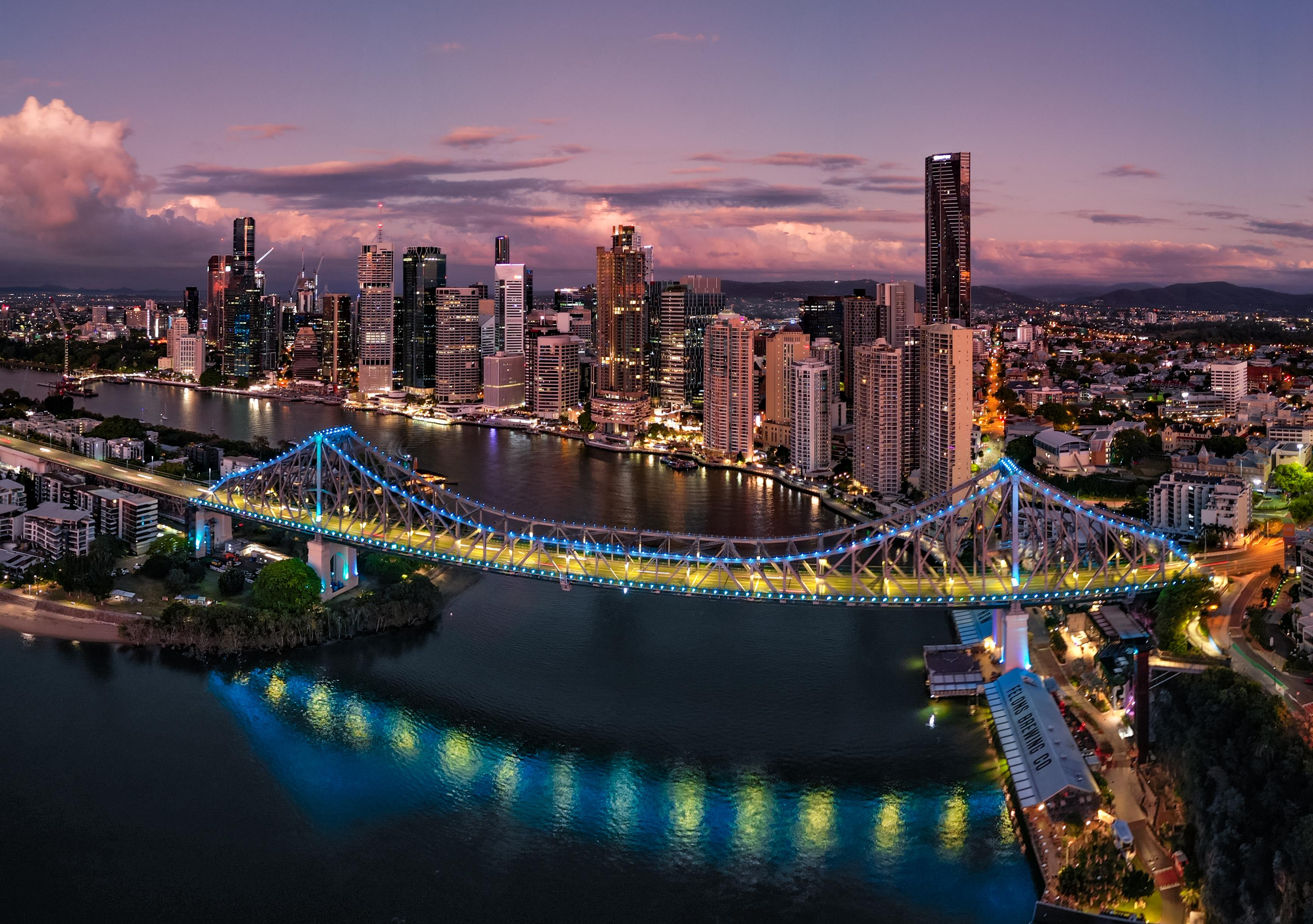 Story Bridge lit up at dusk over Brisbane City